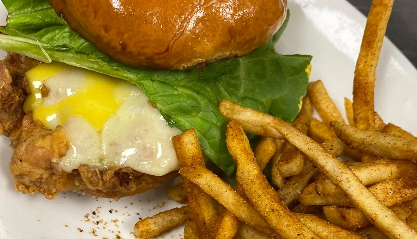 Fried chicken sandwich with a fried egg and fries at McNamara's Pub & Restaurant, Irish pub near Aurora Highlands VA