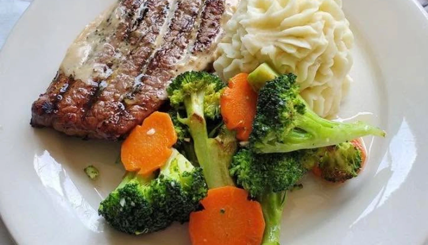 Grilled steak with mashed potatoes, broccoli and carrots at McNamara's Pub & Restaurant, Irish pub near Aurora Highlands VA
