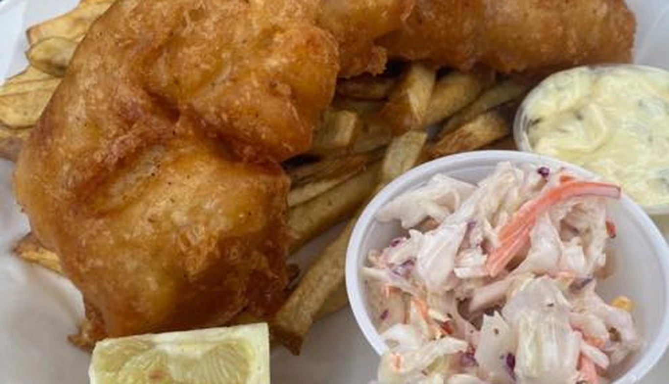 Beer-battered fish and chips with coleslaw and lemon at McNamara's Pub & Restaurant, Irish pub near Aurora Highlands VA