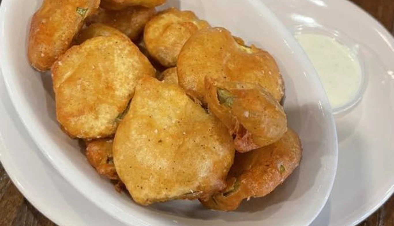 Golden fried appetizer bites with dipping sauce at McNamara's Pub & Restaurant, Irish pub near Foggy Bottom DC